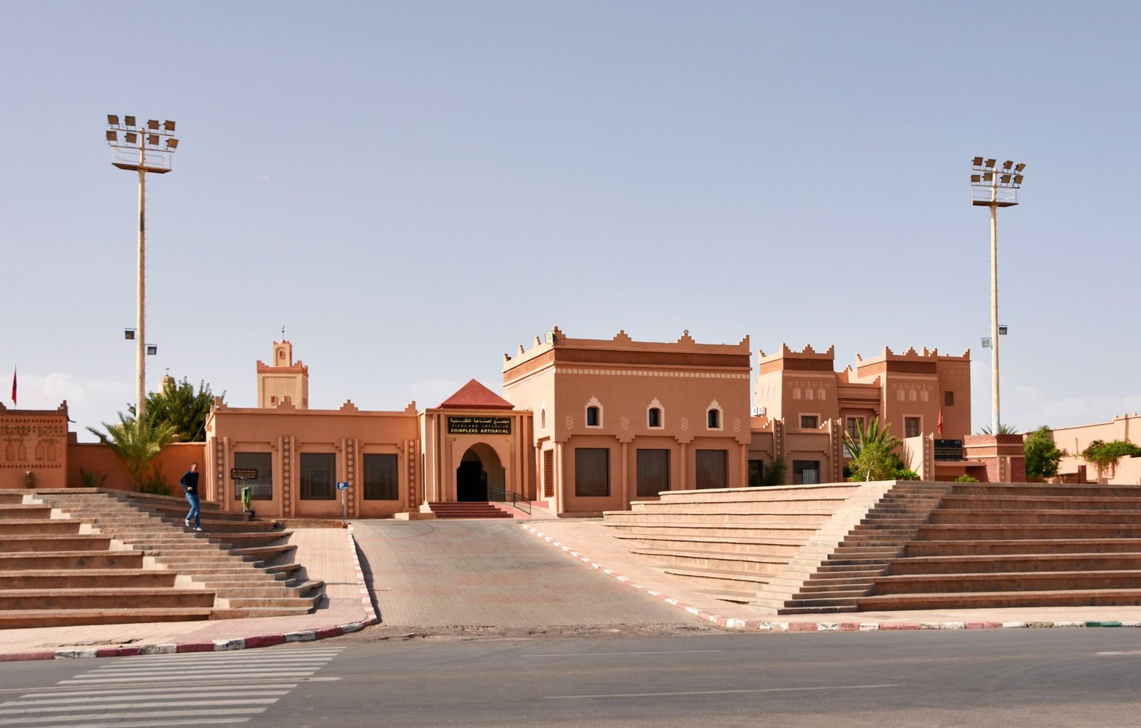 Historic Moroccan buildings with clear sky in Ouarzazate, showcasing traditional design elements.